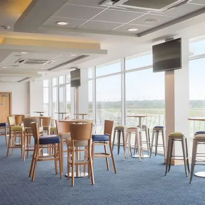 Modern furnishings and balcony in the 1891 Bar which overlooks the racetrack at Wetherby Racecourse.